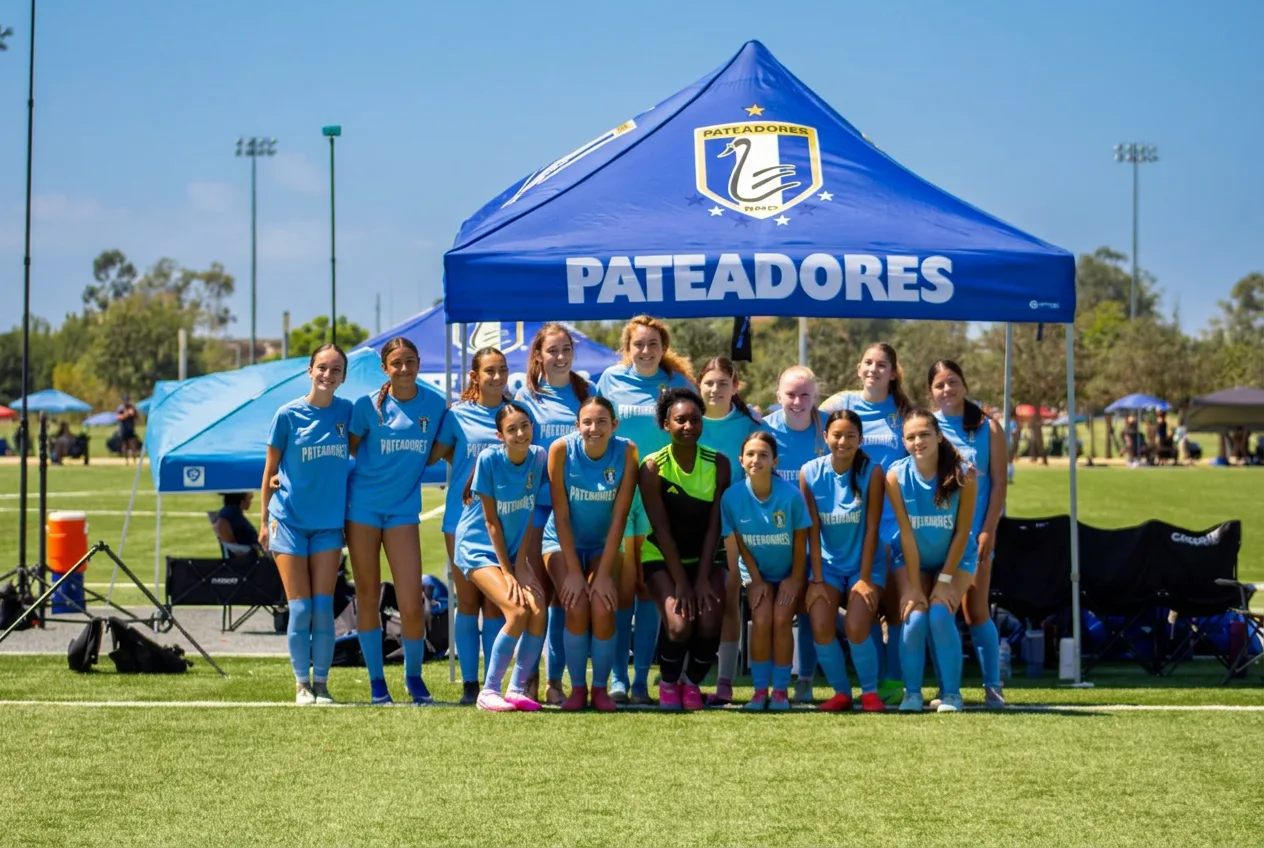 PATEADORES U17 DPL team gathered beneath the club tent